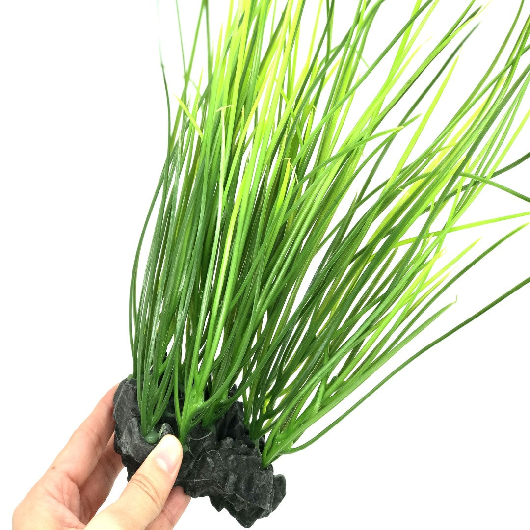 close up of green plastic grass aquarium plant